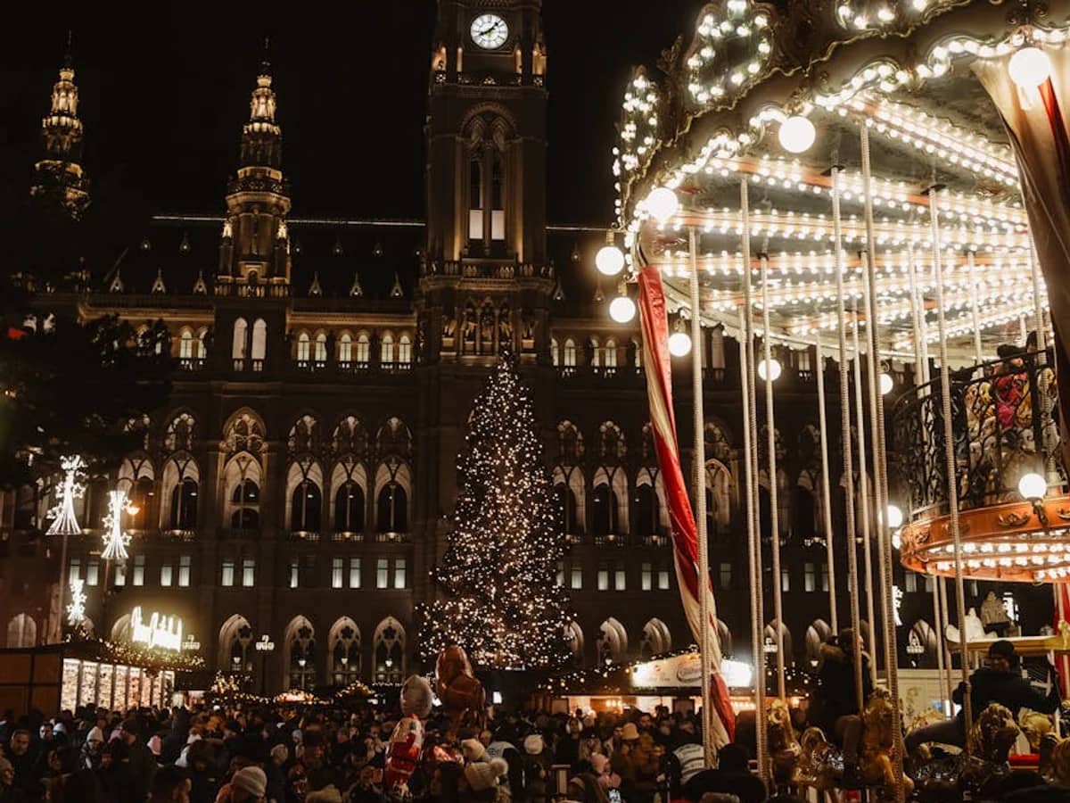 Vienna Rathaus illuminated during festive Christmas market in winter