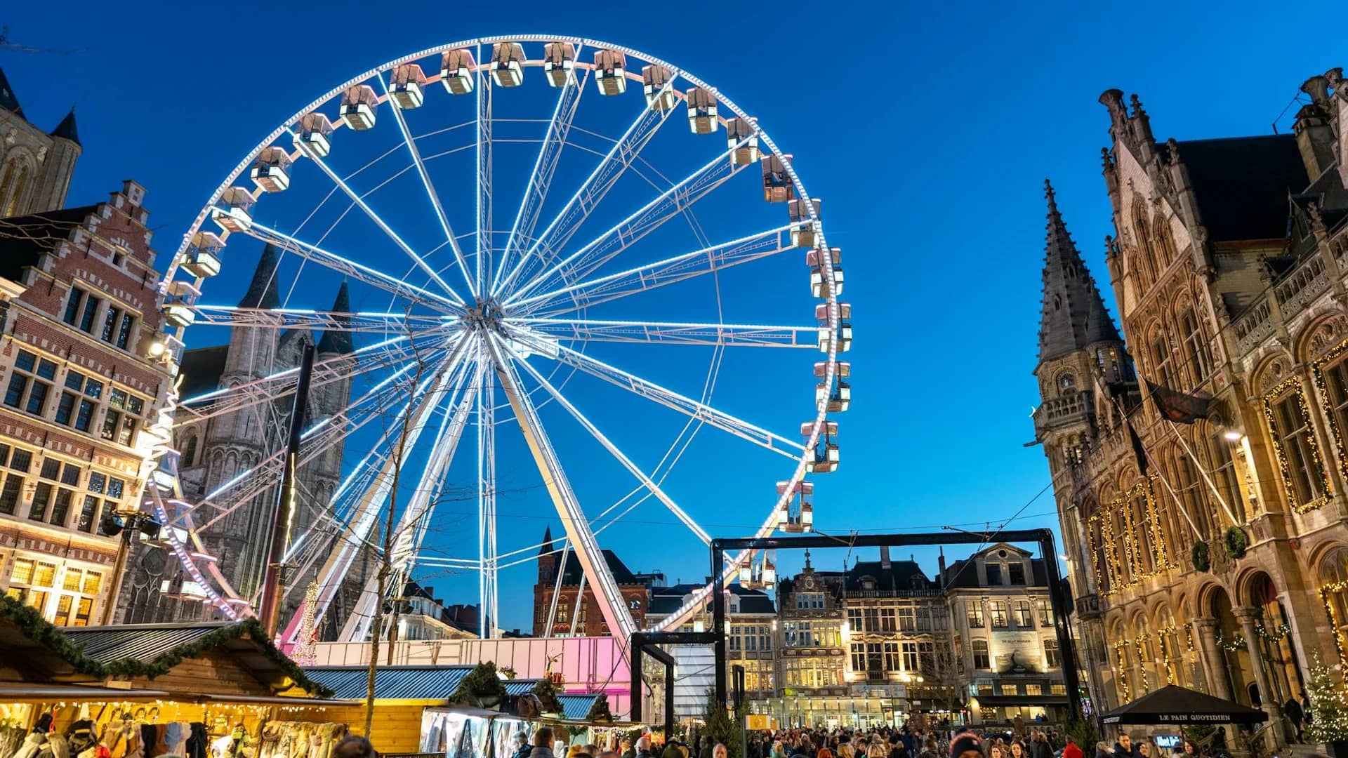 Ghent ferris wheel illuminated at twilight during Christmas season