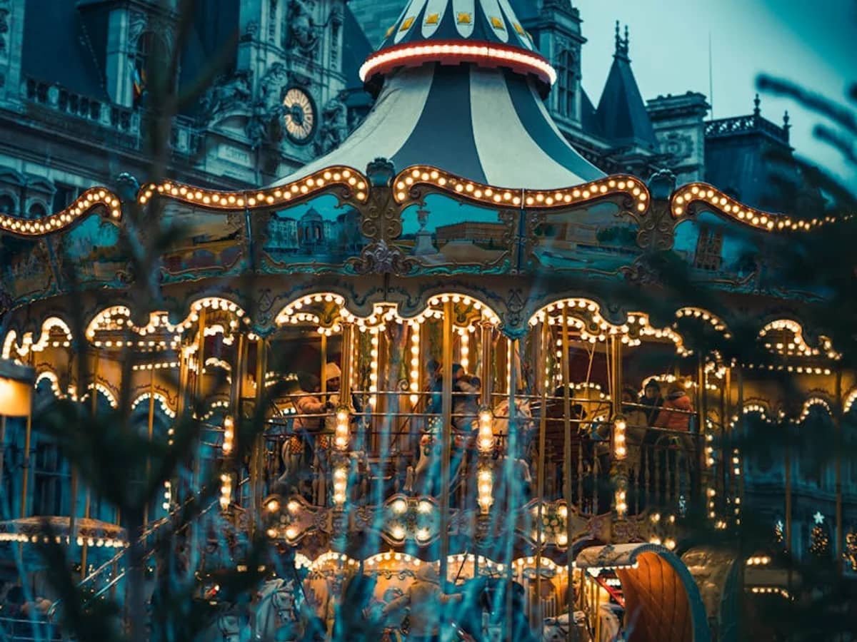 Paris vintage carousel glowing during Christmas in winter evening