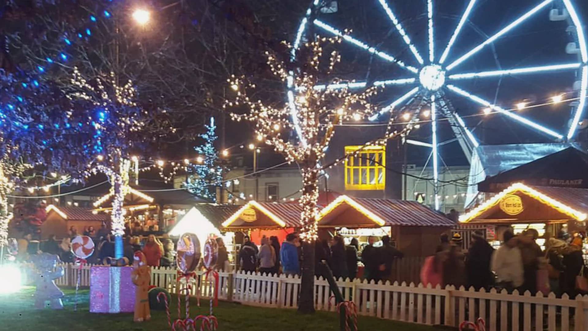 Galway magical Christmas market scene with a glowing Ferris wheel