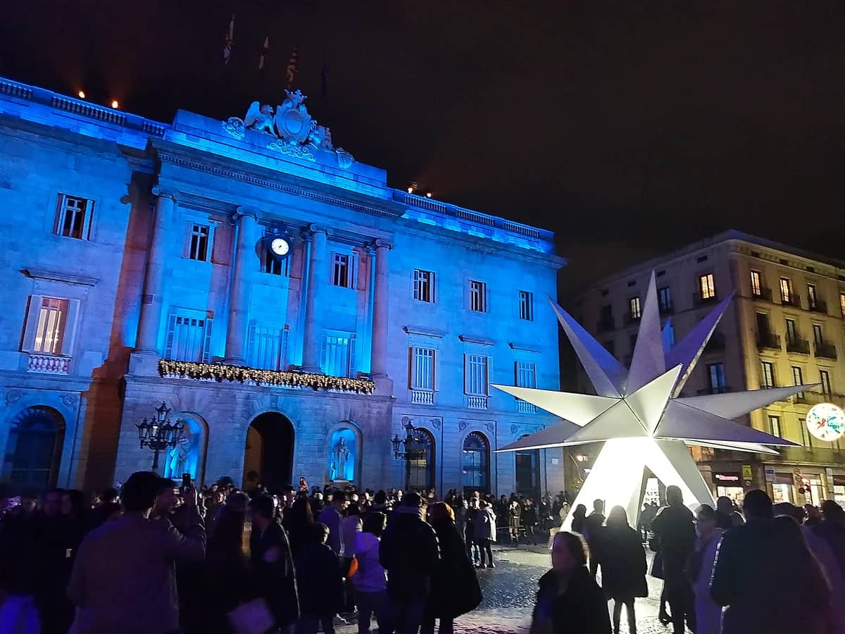 Barcelona City Hall adorned with festive blue lights during Christmas celebrations